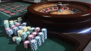 A casino table featuring colorful chips and a roulette wheel, set for a game of chance.