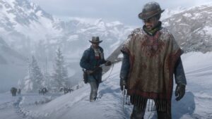 Cowboys trekking through snowy mountains in Red Dead Redemption 2