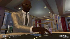 A man in a suit and tie focused on playing blackjack at a casino table.