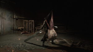Pyramid Head monster wielding massive blade in dark industrial room from Silent Hill 2