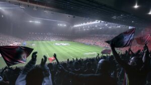 Liverpool stadium atmosphere in EA FC 26 with fans waving flags, showing popularity of Ultimate Team mode.