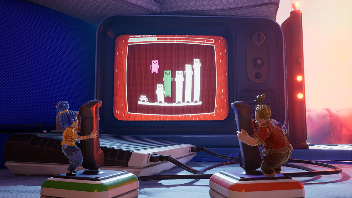Cody and May play a hacking mini-game on a giant screen in It Takes Two