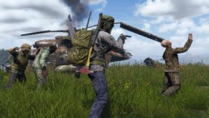 Survivors fight off zombies near a wrecked helicopter in DayZ