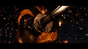 Close-up of a samurai unsheathing a katana with glowing embers in the background from Ghost of Yotei