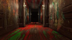 A dimly lit, eerie corridor with splattered red, green, and orange paint covering the walls and floor in Layers of Fear
