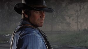Arthur Morgan stares into the misty frontier in Red Dead Redemption 2, reflecting his rugged outlaw life