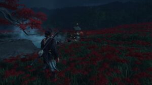Atsu standing among red spider lilies near a lantern shrine at night in Ghost of Yotei