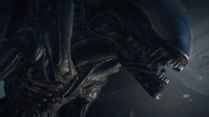 The Xenomorph from Alien Isolation baring its sharp teeth, lurking in the shadows of a spaceship corridor.