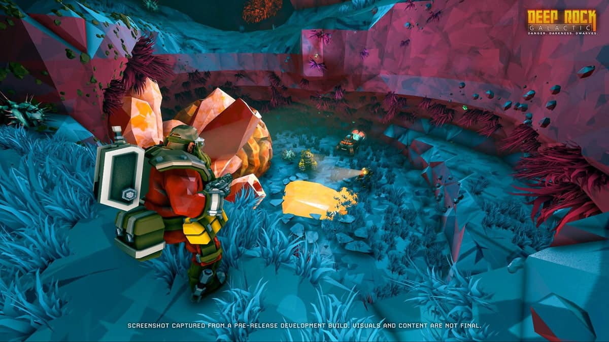 Dwarves explore a colorful cavern while uncovering amber deposits in the Deep Rock Galactic game