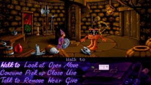 A young wizard wearing a purple robe and hat talks to a living chest with legs in Simon the Sorcerer.