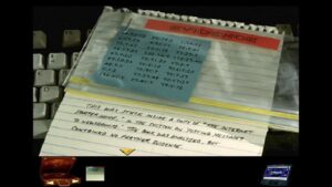 A close-up of a notepad marked “EVIDENCE” with a blue sticky note of coded numbers in Spycraft: The Great Game.