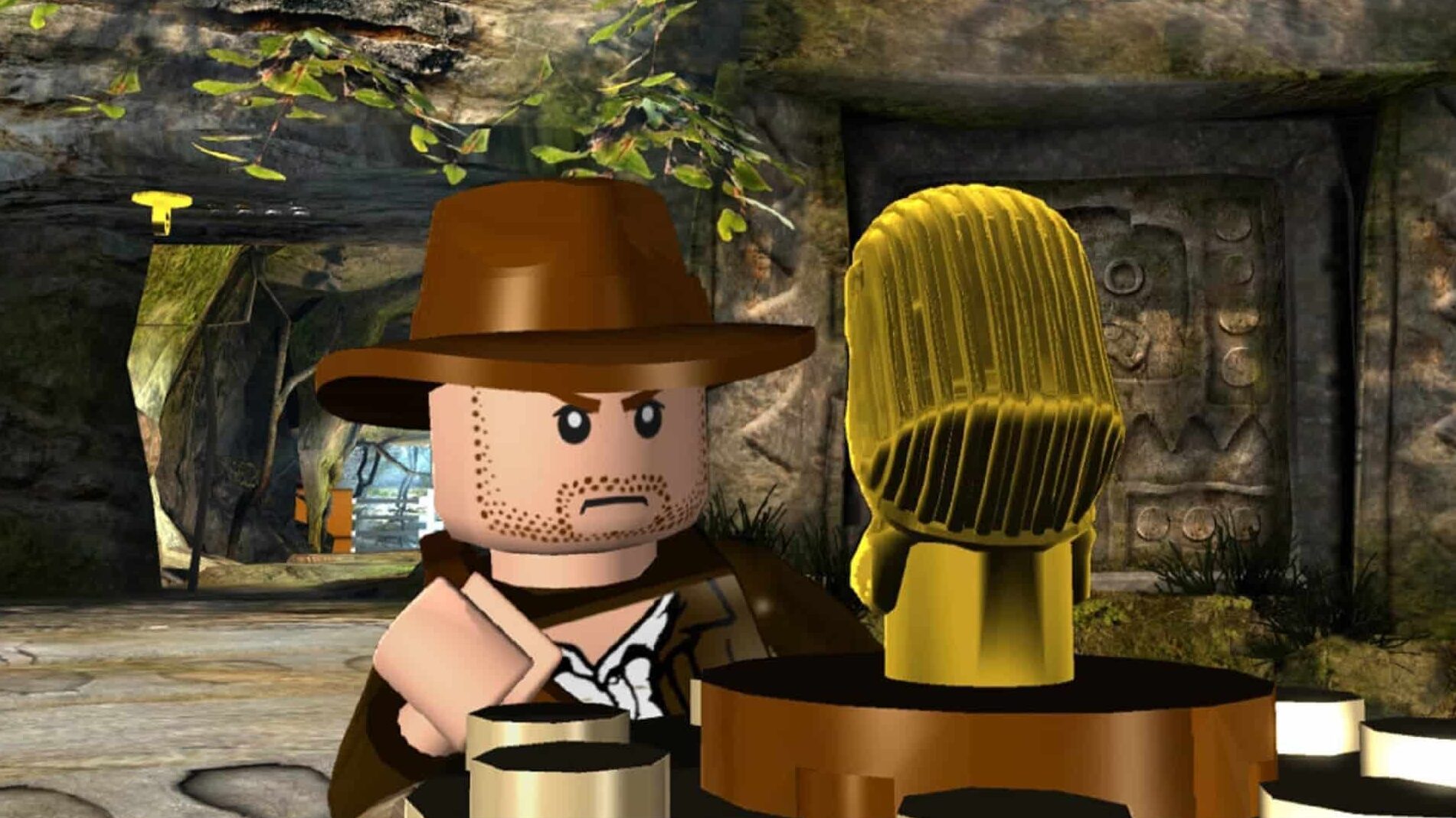 LEGO Indiana Jones examining a golden idol inside a stone temple